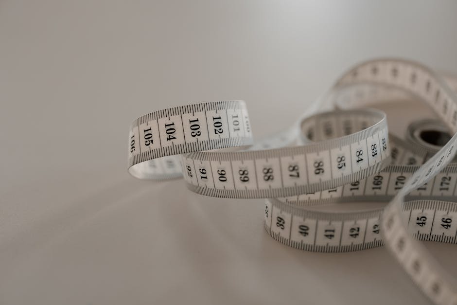 A ruler and measuring tape showing metric and imperial units side by side